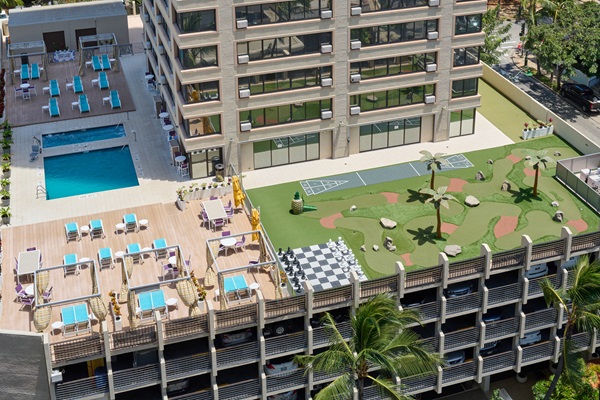 a building with a pool and a golf course